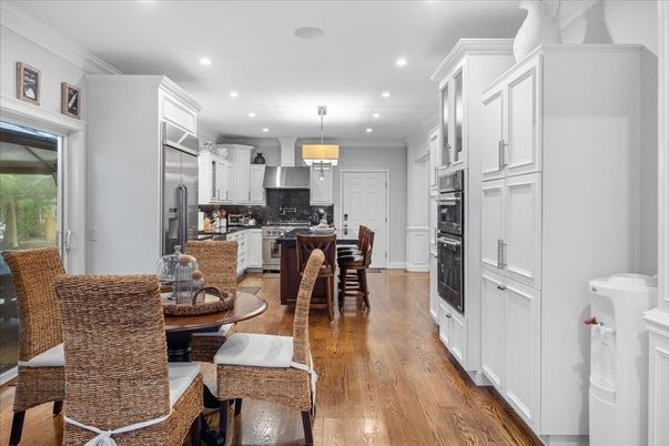 Dining room, Interior, Kitchen, Pendant Lights, Recessed Lighting, Stainless Steel Appliances, Wood Texture Flooring