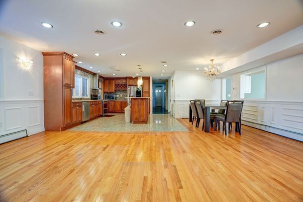 Chandelier, Dining room, Interior, Kitchen, Pendant Lights, Recessed Lighting, Stainless Steel Appliances, Wood Texture Flooring