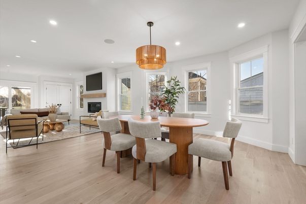 Chandelier, Dining room, Fireplace, Interior, Living room, Pendant Lights, Recessed Lighting, Wood Texture Flooring