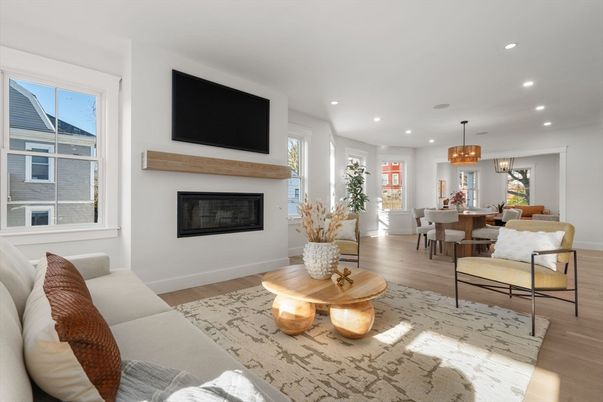 Chandelier, Dining room, Fireplace, Interior, Living room, Pendant Lights, Recessed Lighting, Wood Texture Flooring