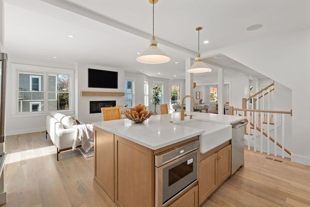 Fireplace, Interior, Kitchen, Living room, Pendant Lights, Recessed Lighting, Stainless Steel Appliances, Wood Texture Flooring