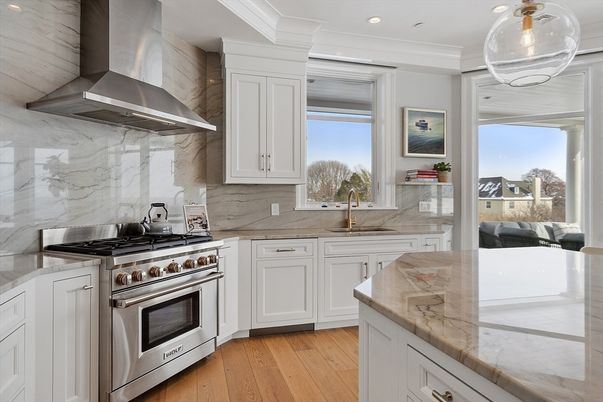 Interior, Kitchen, Marble Walls, Pendant Lights, Recessed Lighting, Stainless Steel Appliances, Wood Texture Flooring