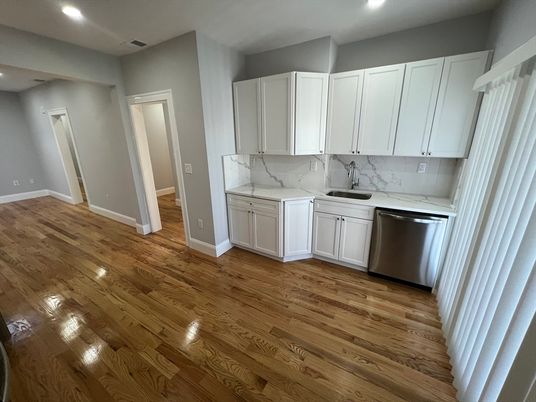 Interior, Kitchen, Marble Walls, Recessed Lighting, Stainless Steel Appliances, Wood Texture Flooring