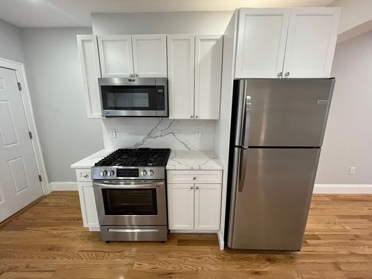 Interior, Kitchen, Marble Walls, Stainless Steel Appliances, Wood Texture Flooring