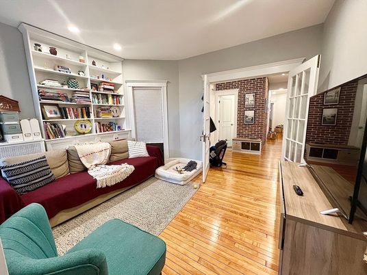 Fireplace, Interior, Living room, Recessed Lighting, Stone Walls, Wood Texture Flooring