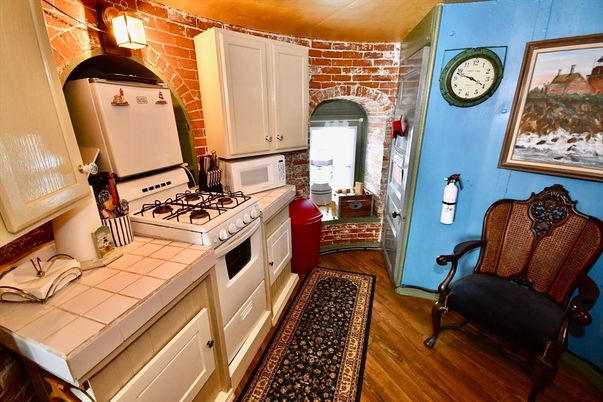 Interior, Kitchen, Stone Walls, Tile Countertops, Wood Texture Flooring