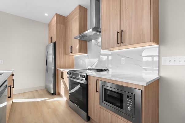 Interior, Kitchen, Marble Walls, Recessed Lighting, Stainless Steel Appliances, Wood Texture Flooring