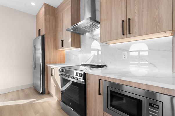 Interior, Kitchen, Marble Walls, Recessed Lighting, Stainless Steel Appliances, Wood Texture Flooring