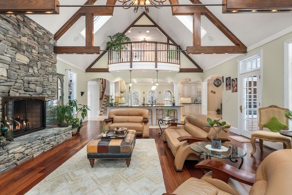 Chandelier, Fireplace, Interior, Living room, Recessed Lighting, Stone Walls, Wooden Beams, Wood Texture Flooring