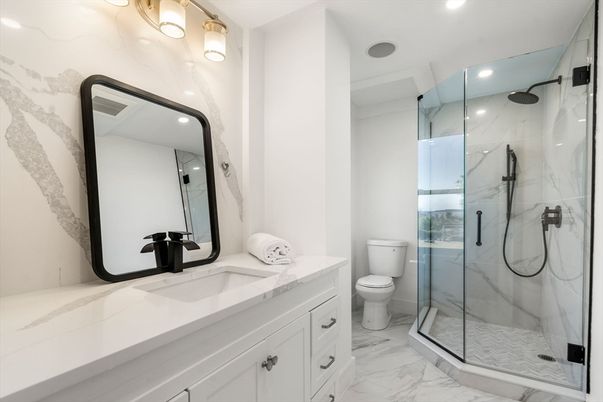 Bathroom, Dual Sink Vanities, Glass Shower, Interior, Marble, Marble Walls, Recessed Lighting