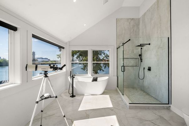 Bathroom, Free Standing Baths, Glass Shower, Interior, Marble, Marble Walls, Recessed Lighting, Water