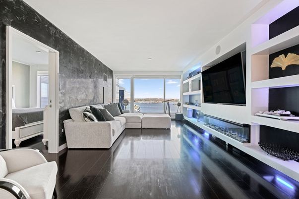 Fireplace, Interior, Living room, Recessed Lighting, Stone Walls, Water, Wood Texture Flooring