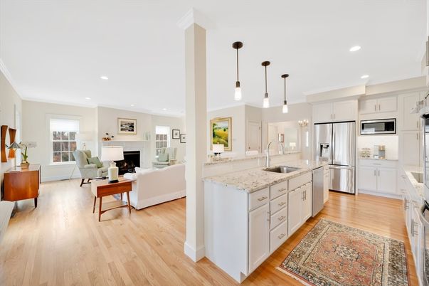 Fireplace, Interior, Kitchen, Living room, Pendant Lights, Recessed Lighting, Stainless Steel Appliances, Wood Texture Flooring
