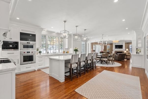Chandelier, Dining room, Interior, Kitchen, Living room, Pendant Lights, Recessed Lighting, Stainless Steel Appliances, Wood Texture Flooring