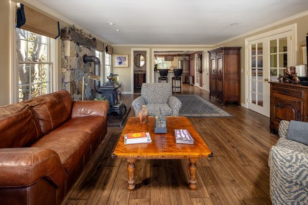 Fireplace, Interior, Living room, Recessed Lighting, Stone Walls, Wood Texture Flooring