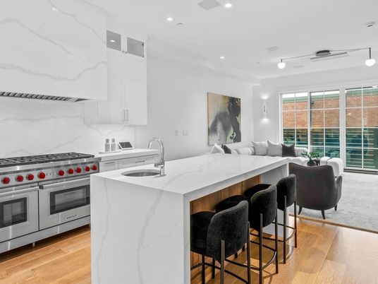 Interior, Kitchen, Marble Walls, Recessed Lighting, Stainless Steel Appliances, Wood Texture Flooring