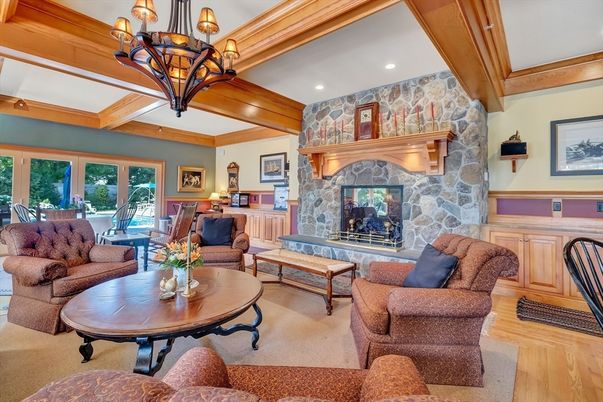 Chandelier, Dining room, Fireplace, Interior, Living room, Recessed Lighting, Stone Walls, Wooden Beams, Wood Texture Flooring