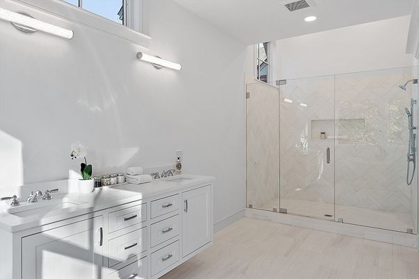 Bathroom, Dual Sink Vanities, Glass Shower, Interior, Marble Walls, Recessed Lighting, Wood Texture Flooring