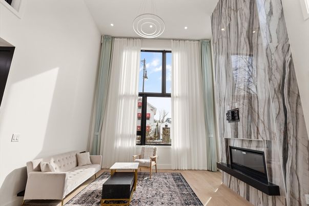 Fireplace, Interior, Living room, Marble Walls, Pendant Lights, Recessed Lighting, Wood Texture Flooring