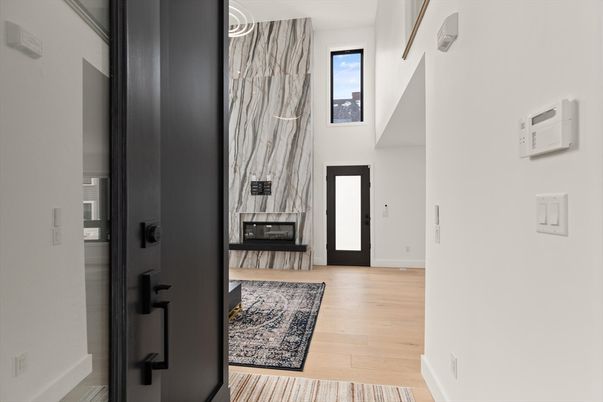 Fireplace, Interior, Marble Walls, Pendant Lights, Wood Texture Flooring