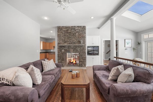 Fireplace, Interior, Living room, Recessed Lighting, Stone Walls, Wood Texture Flooring