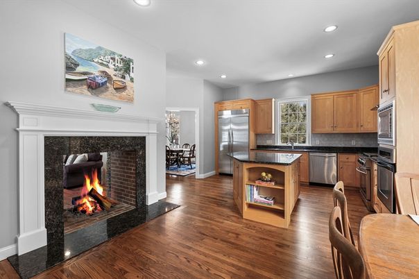Dining room, Fireplace, Interior, Kitchen, Recessed Lighting, Stainless Steel Appliances, Wood Texture Flooring