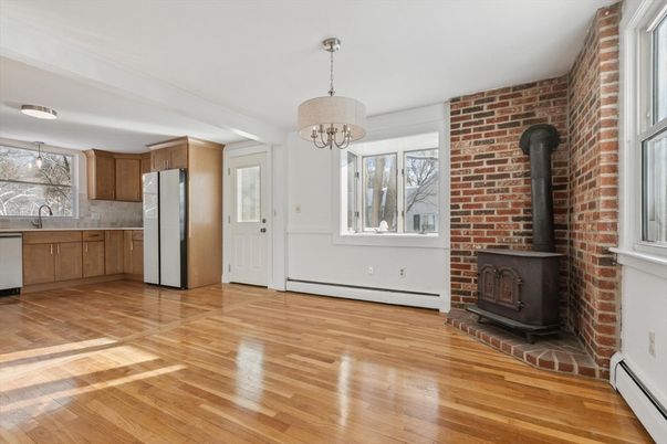 Chandelier, Fireplace, Interior, Kitchen, Pendant Lights, Stone Walls, Wood Texture Flooring