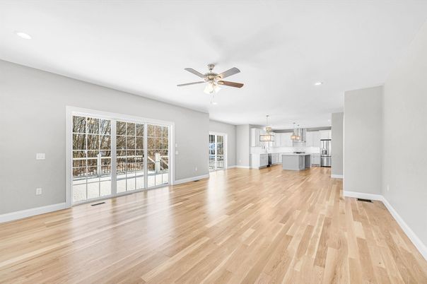 Empty room, Interior, Kitchen, Pendant Lights, Recessed Lighting, Stainless Steel Appliances, Wood Texture Flooring