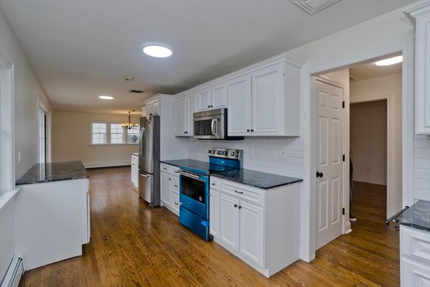 Chandelier, Interior, Kitchen, Pendant Lights, Recessed Lighting, Stainless Steel Appliances, Wood Texture Flooring