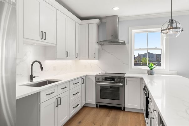 Interior, Kitchen, Marble Walls, Pendant Lights, Recessed Lighting, Stainless Steel Appliances, Wood Texture Flooring