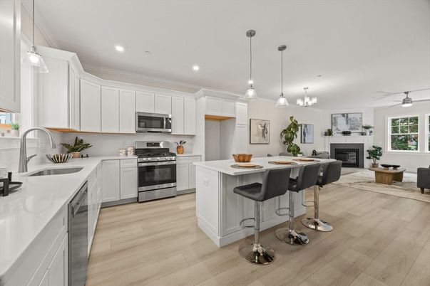 Fireplace, Interior, Kitchen, Living room, Pendant Lights, Recessed Lighting, Stainless Steel Appliances, Wood Texture Flooring
