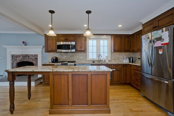 Fireplace, Interior, Kitchen, Pendant Lights, Recessed Lighting, Stainless Steel Appliances, Wood Texture Flooring