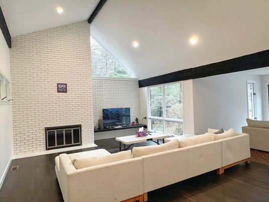Fireplace, Interior, Living room, Recessed Lighting, Stone Walls, Wood Texture Flooring