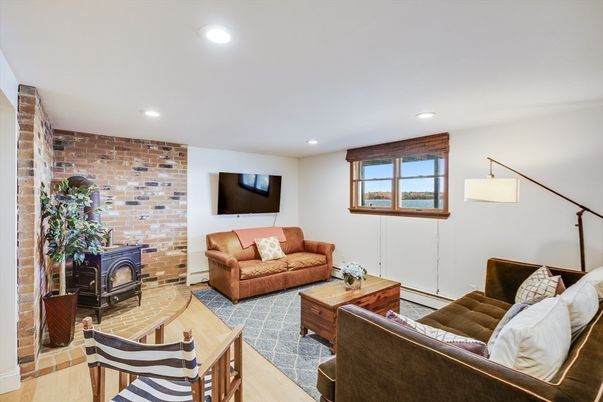 Fireplace, Interior, Living room, Recessed Lighting, Stone Walls, Wood Texture Flooring