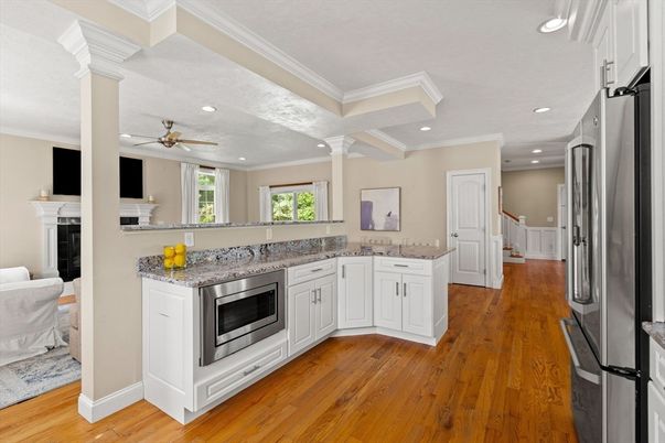 Fireplace, Interior, Kitchen, Recessed Lighting, Stainless Steel Appliances, Wood Texture Flooring