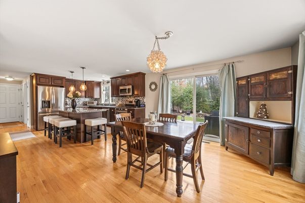 Chandelier, Dining room, Interior, Kitchen, Pendant Lights, Recessed Lighting, Stainless Steel Appliances, Wood Texture Flooring
