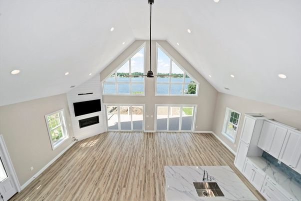 Empty room, Fireplace, Interior, Marble, Pendant Lights, Recessed Lighting, Water, Wood Texture Flooring