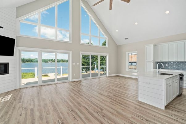 Empty room, Fireplace, Interior, Kitchen, Recessed Lighting, Water, Wood Texture Flooring