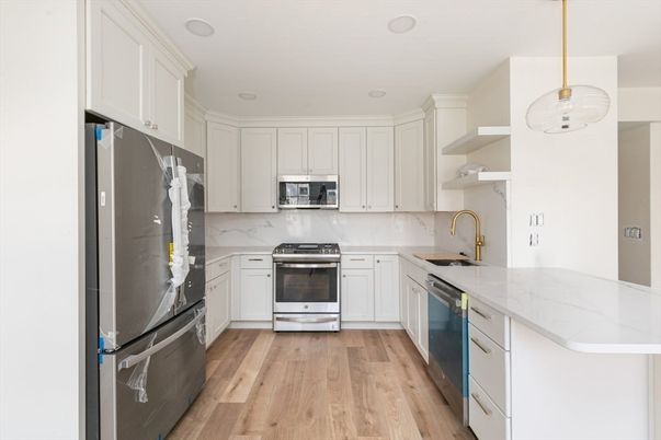 Interior, Kitchen, Pendant Lights, Recessed Lighting, Stainless Steel Appliances, Wood Texture Flooring