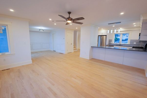 Empty room, Interior, Kitchen, Recessed Lighting, Stainless Steel Appliances, Wood Texture Flooring