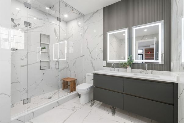 Bathroom, Dual Sink Vanities, Glass Shower, Interior, Marble, Marble Walls, Recessed Lighting