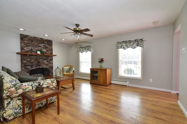 Fireplace, Interior, Living room, Recessed Lighting, Stone Walls, Wood Texture Flooring