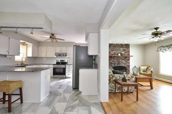 Fireplace, Interior, Kitchen, Recessed Lighting, Stainless Steel Appliances, Stone Walls, Wood Texture Flooring