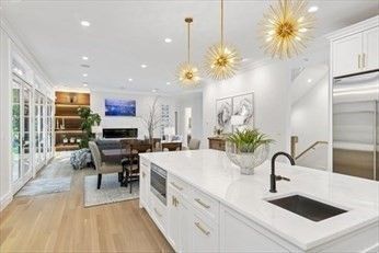 Dining room, Fireplace, Interior, Kitchen, Living room, Pendant Lights, Recessed Lighting, Stainless Steel Appliances, Wood Texture Flooring