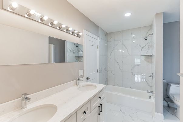 Bathroom, Dual Sink Vanities, Interior, Marble, Marble Walls, Recessed Lighting
