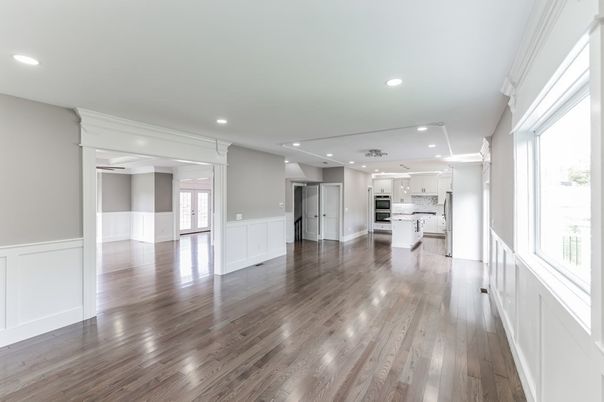 Empty room, Interior, Kitchen, Recessed Lighting, Stainless Steel Appliances, Wood Texture Flooring