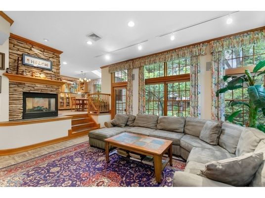 Chandelier, Dining room, Fireplace, Interior, Living room, Recessed Lighting, Stone Walls, Wood Texture Flooring
