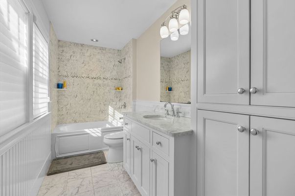Bathroom, Dual Sink Vanities, Glass Shower, Interior, Marble, Marble Walls, Recessed Lighting