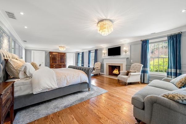 Bedroom, Chandelier, Fireplace, Interior, Recessed Lighting, Wood Texture Flooring