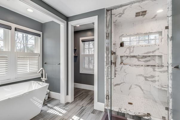 Bathroom, Free Standing Baths, Glass Shower, Interior, Marble Walls, Recessed Lighting, Wood Texture Flooring